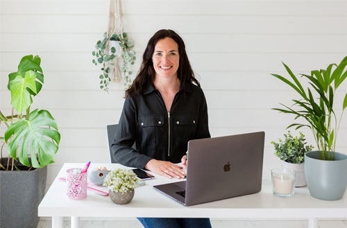 Laura Clark sitting at a desk