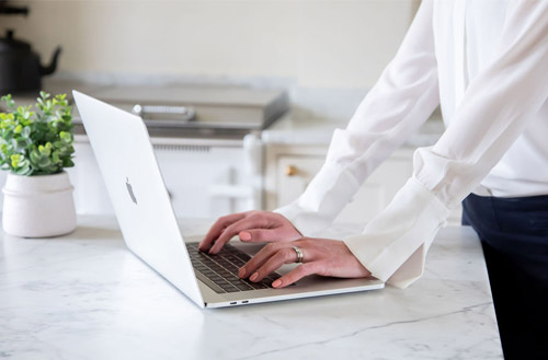 Laura Clark typing on a laptop